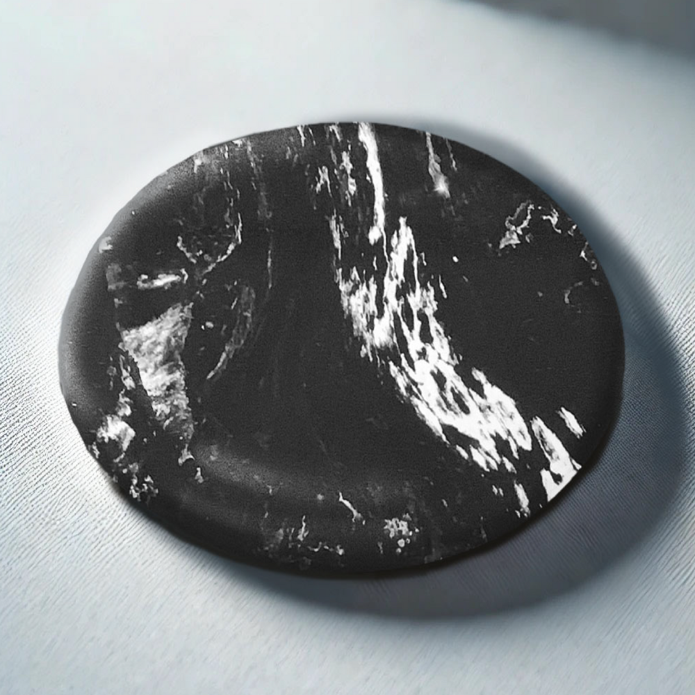 Black marbled stone on a light gray background