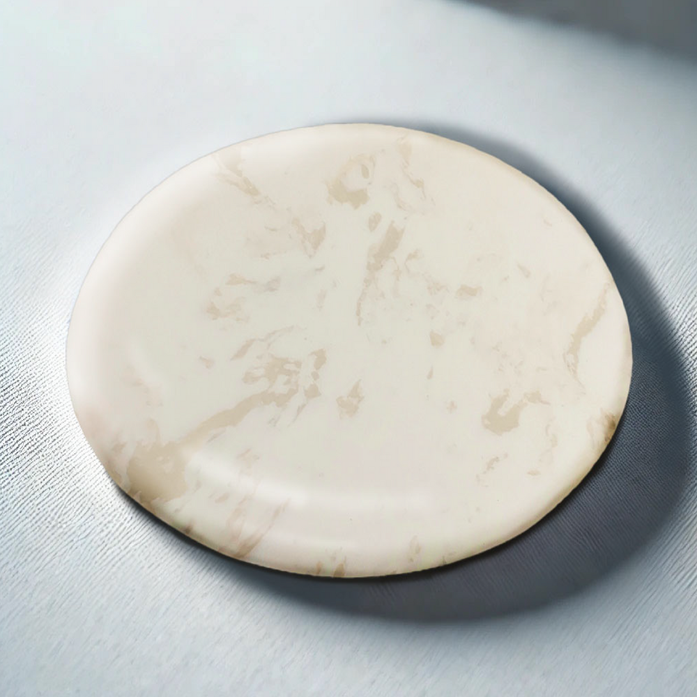Round marble coaster on a light gray surface